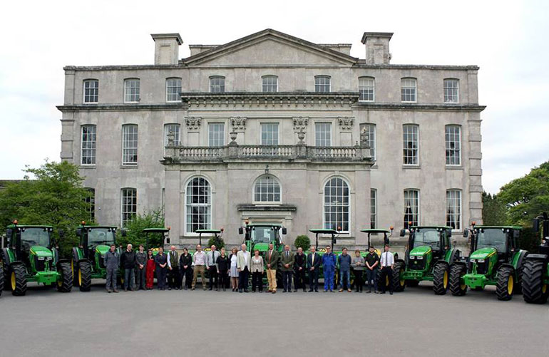 Kingston Maurward students and staff with fleet of brand new John Deere tractors