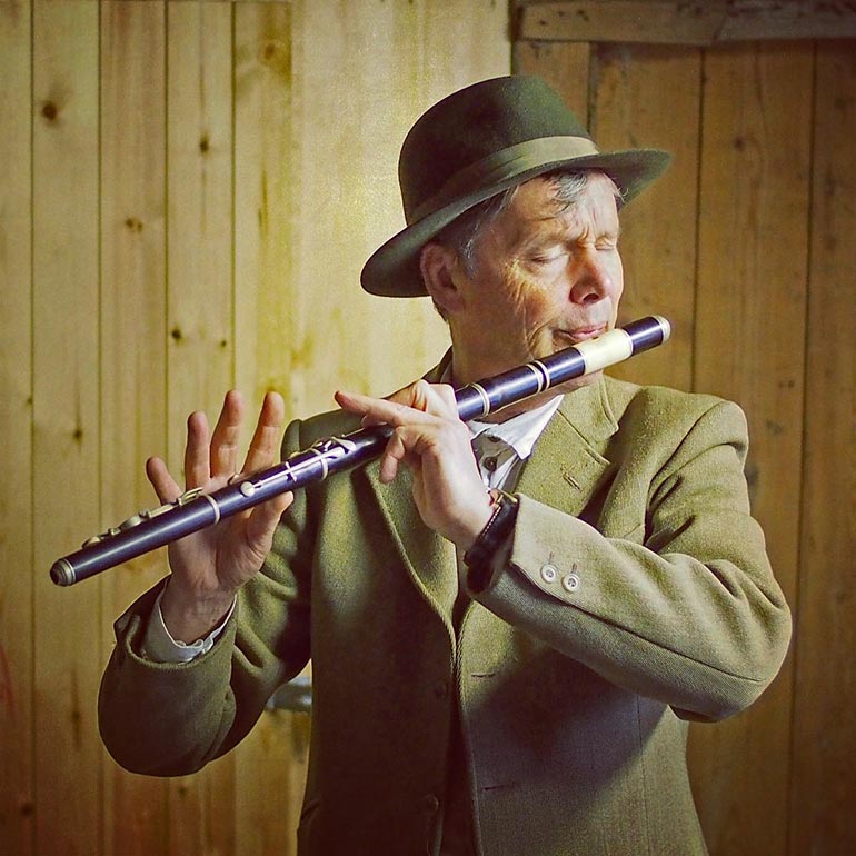 Tim Laycock playing flute at Hardy's Cottage
