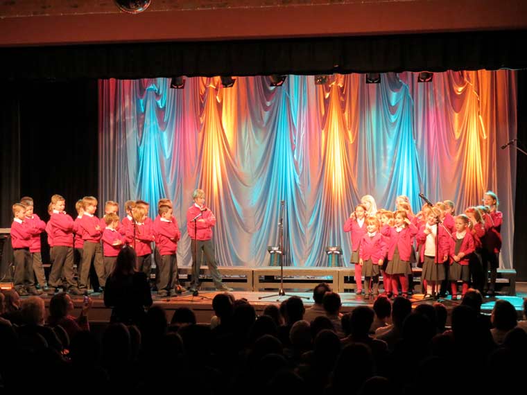 The winning choir from Wimborne St Giles First School brought their song to life