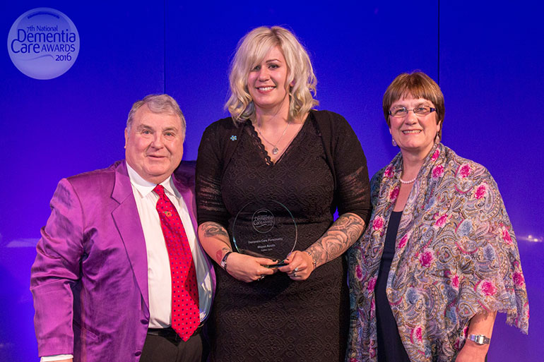 Meg Austin receives her Care Personality award from astrologer Russell Grant and Barbara Stephens, Chief Executive of Dementia Pathfinders Community Interest Company, who made the winner's announcement