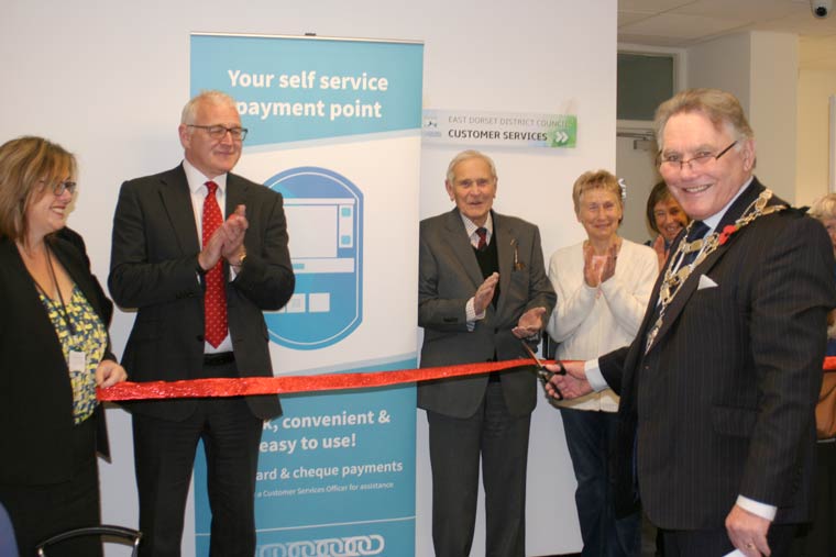 Performing the cutting of the ribbon on the opening of the new Offices