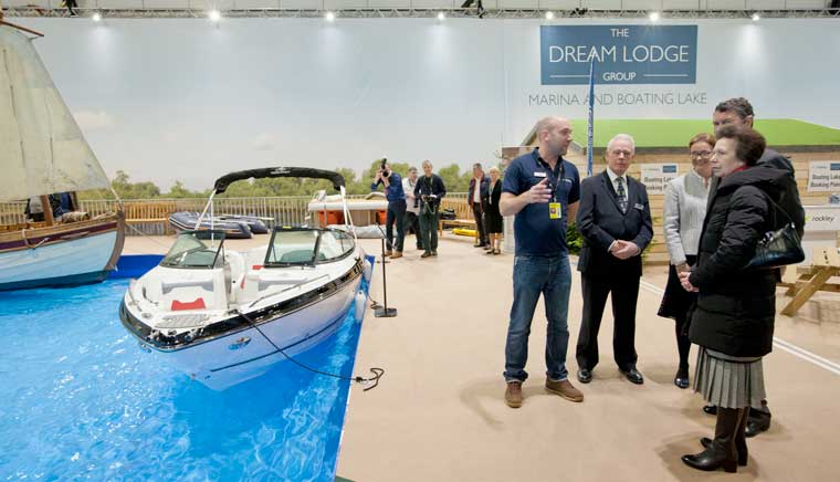 HRH The Princess Royal and Vice Admiral Sir Tim Laurence being shown the Dream Lodge Marina & Boating Lake by the Rockley team at London Boat Show