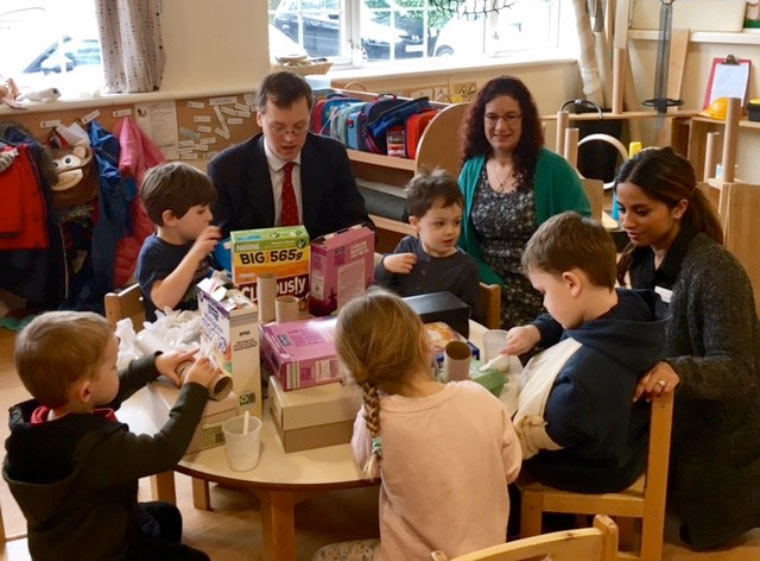 Michael Tomlinson, MP for Mid Dorset and North Poole, visited Tops Day Nursery