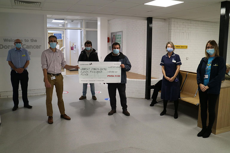 L-R, David Frost, head of therapy radiography; Dr Michael Bayne, consultant in oncology; Ben Trimm, Philip’s son; Philip Trim; Ally Brooks, clinical nurse specialist; Hayley Harris, community fundraiser for Poole Hospital Charity