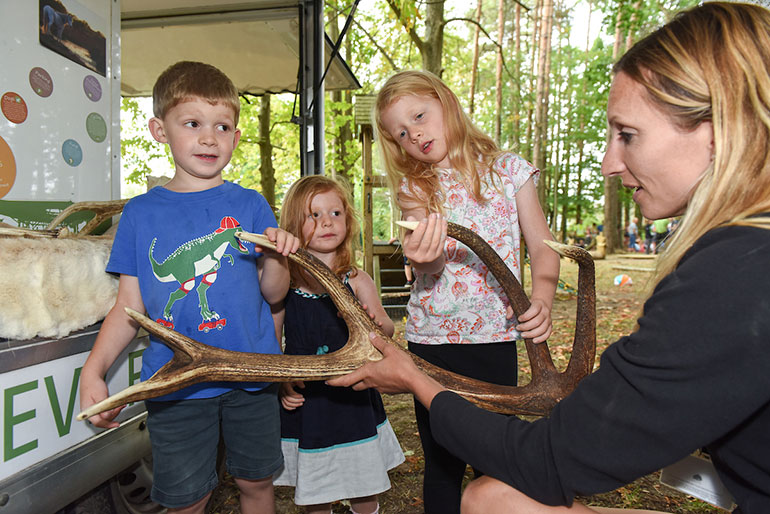 Rangers engaging with children at Ashurst wild play site