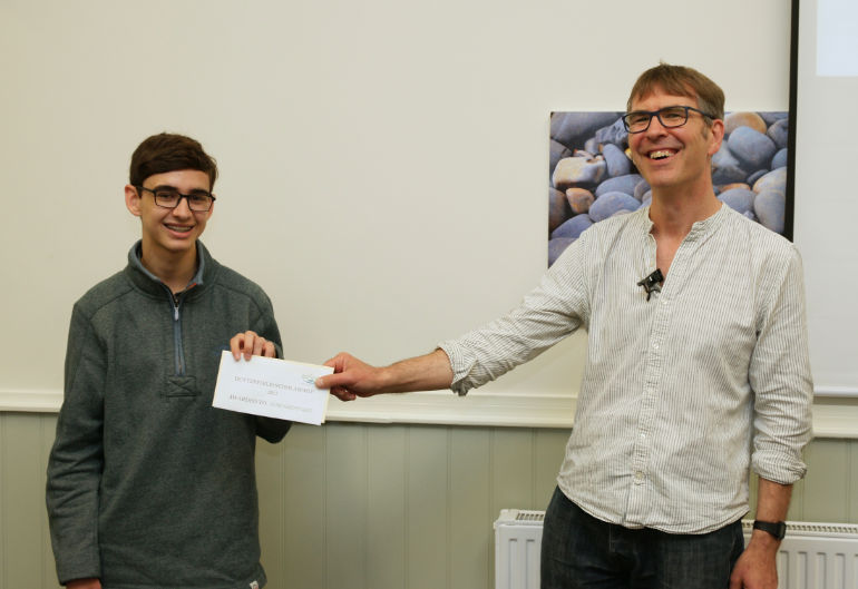 Professor Ryan Lavelle of Winchester University presents Tom Sheppard with a cheque