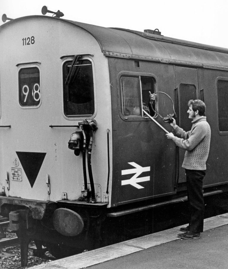 Bob Richards, holding the signalling staff tube at Corfe Castle in December, 1971, showing a young Peter Frost in the cab © Anthony E Trood