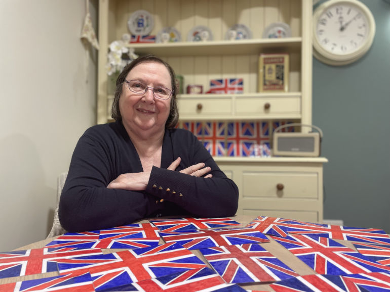 Joyce Holden is colouring in 70 Union Jacks as bunting for a Jubilee garden party