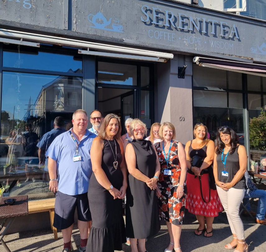 Representatives from EDAS and Dorset HealthCare with attendees of Coffee Connection outside Serenitea Café