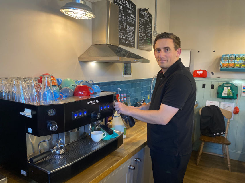 Cafe Manager Zach Foote preparing a coffee at Colin's Nest in Bournemouth