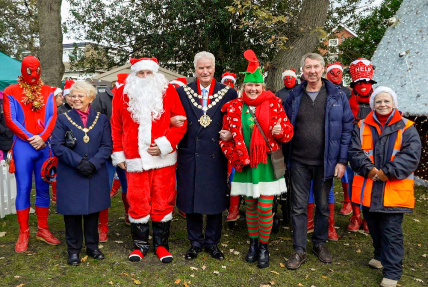 The Bournemouth Mayor Cllr Bob Lawton and wife June with Santa and some of the Spiderman band at Southbourne’s Christmas on the Green