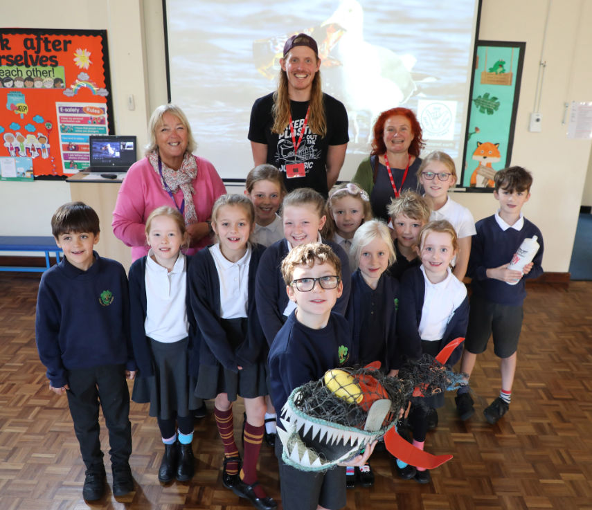 (l-r) Kim Hodder, Hayeswood School’s Eco Lead, Oly Rush and Sarah Wise from Wimborne War on Waste, with members of the school’s Eco Club and a shark made from washed-up plastic