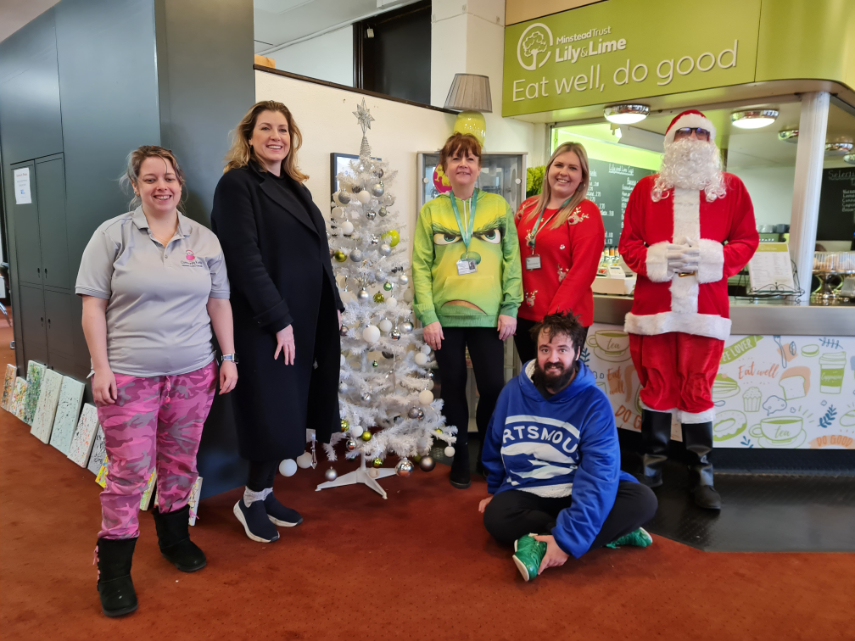 L-R: Community Kettle representative; Penny Mordaunt MP; Lisa Lee, Minstead Trust Regional Director of Care; Sophie Enright, Minstead Trust Service and Hospitality Manager; Matthew (supported by Minstead Trust); Matthew Parrant, Minstead Trust Registered Manager (Father Christmas)