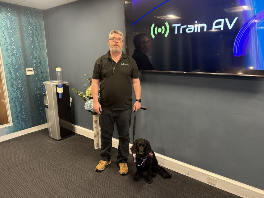 Train AV founder and director Mike Lammas with his hearing assistance dog Ron