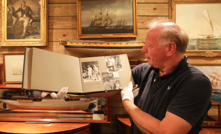 Antique dealer Charles Wallrock with the Britannia photo album