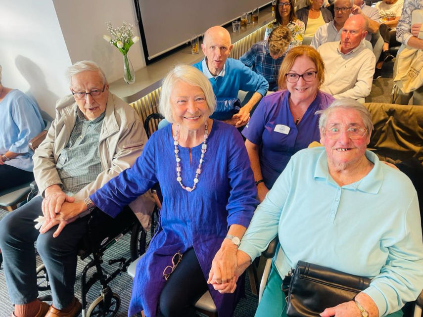 Former BBC war correspondent, Kate Adie, pictured holding hands with some of the guests at an event hosted by Lewis-Manning at Parkstone Yacht Club