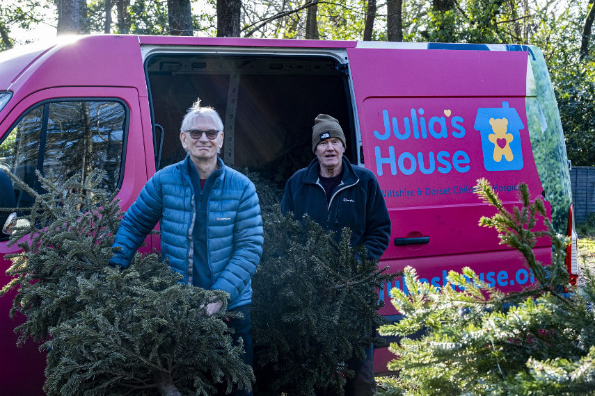 Julia's House volunteers collect real Christmas trees for donations